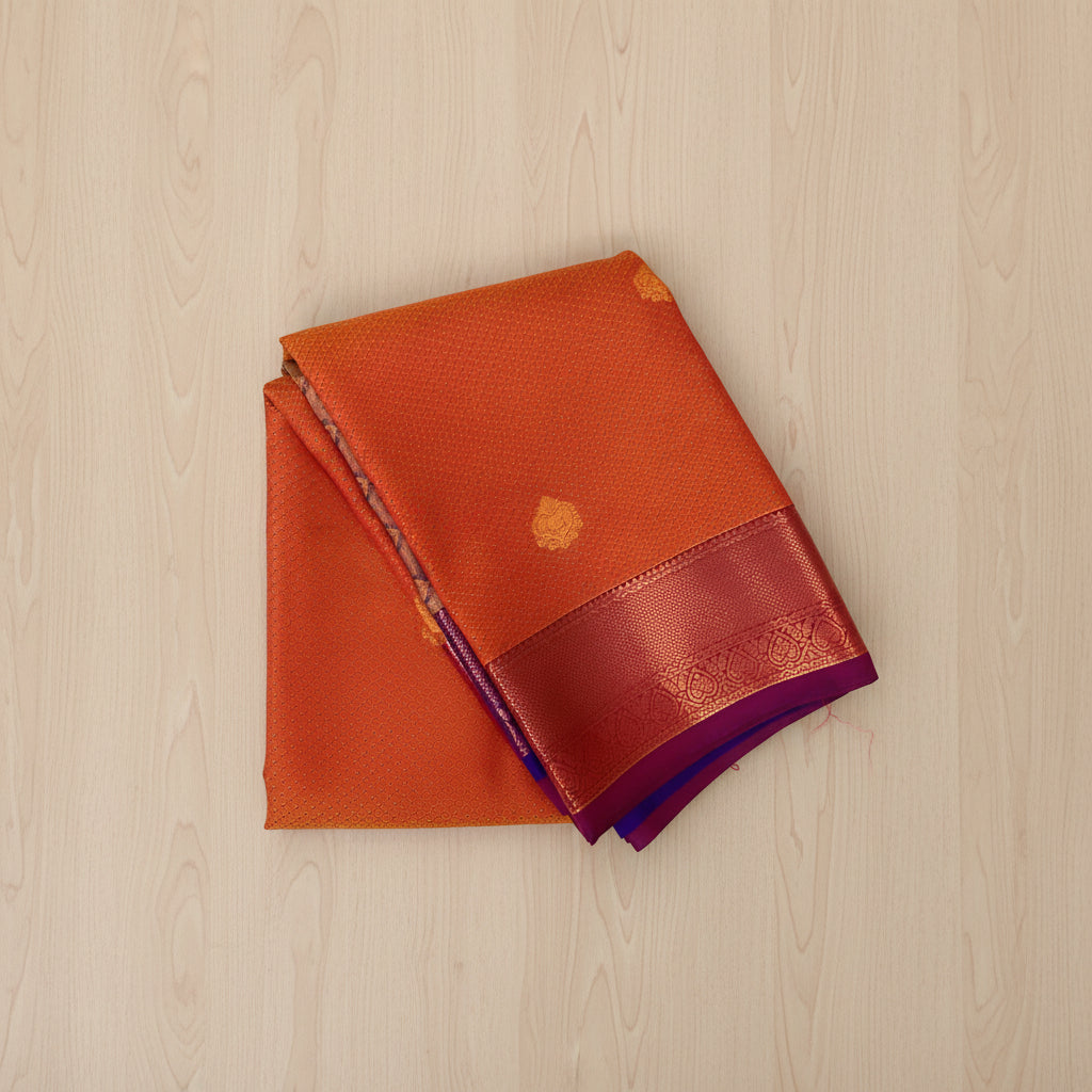 Rust Orange Silk Saree with Copper Buti and Purple Pallu