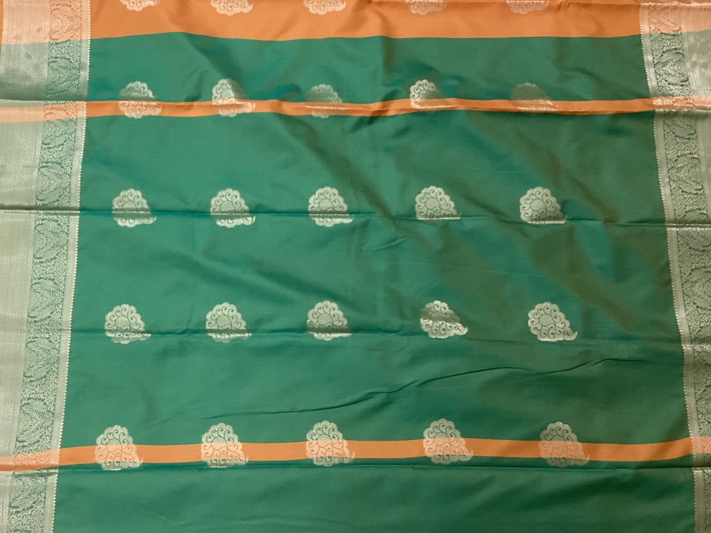 Teal And Burnt Orange Paisley Saree With Silver Brocade Border