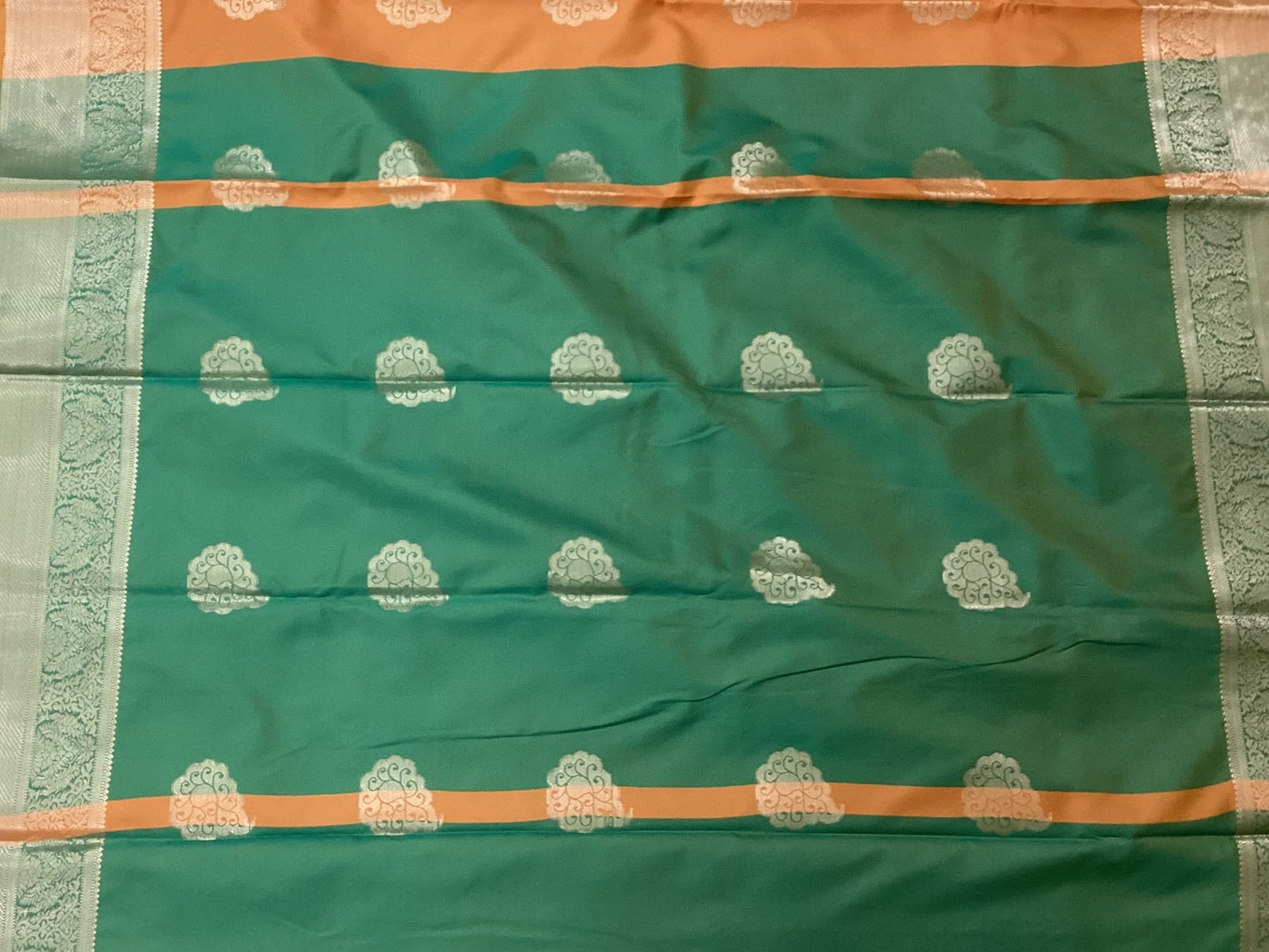 Teal And Burnt Orange Paisley Saree With Silver Brocade Border
