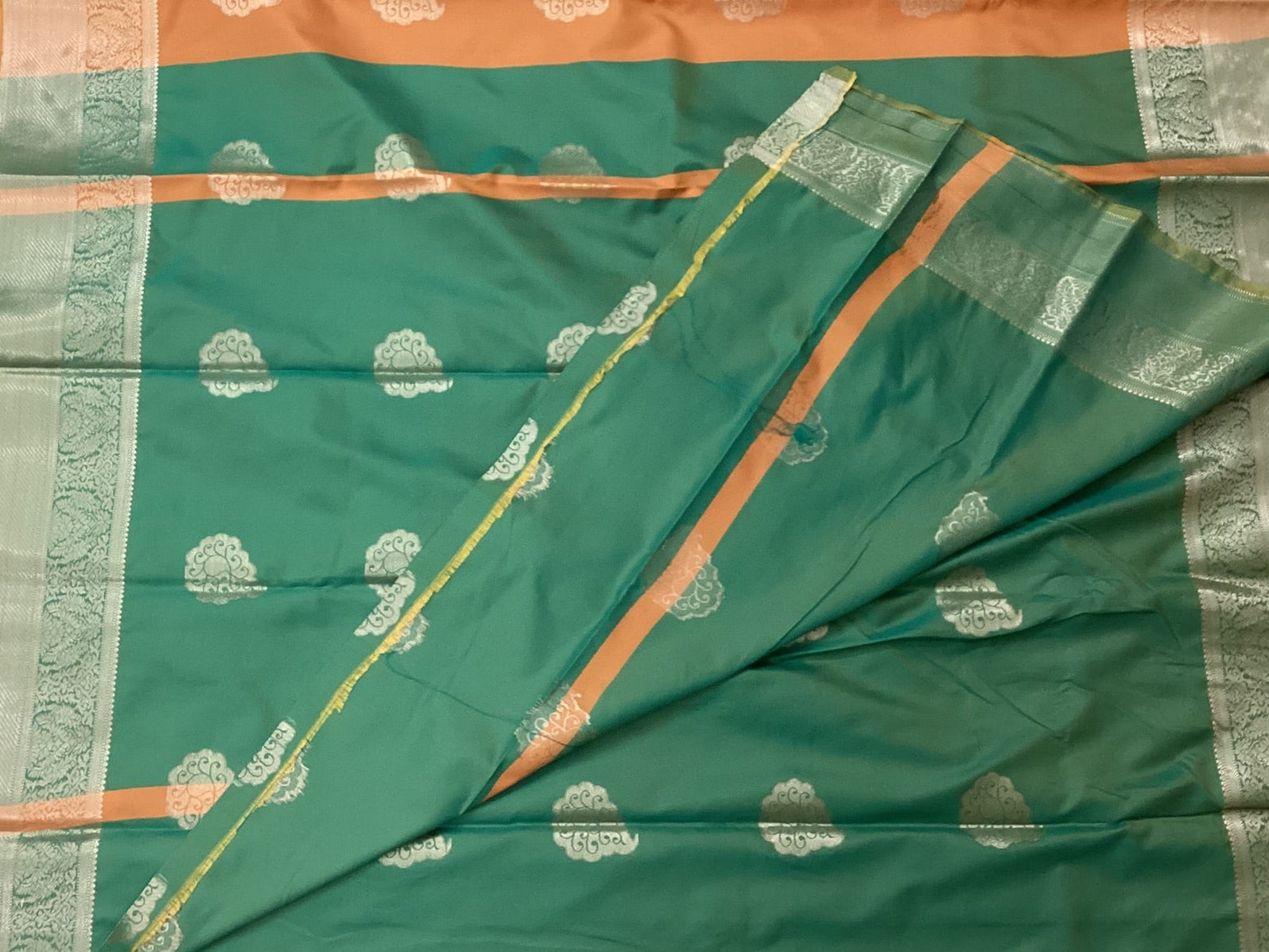 Teal And Burnt Orange Paisley Saree With Silver Brocade Border