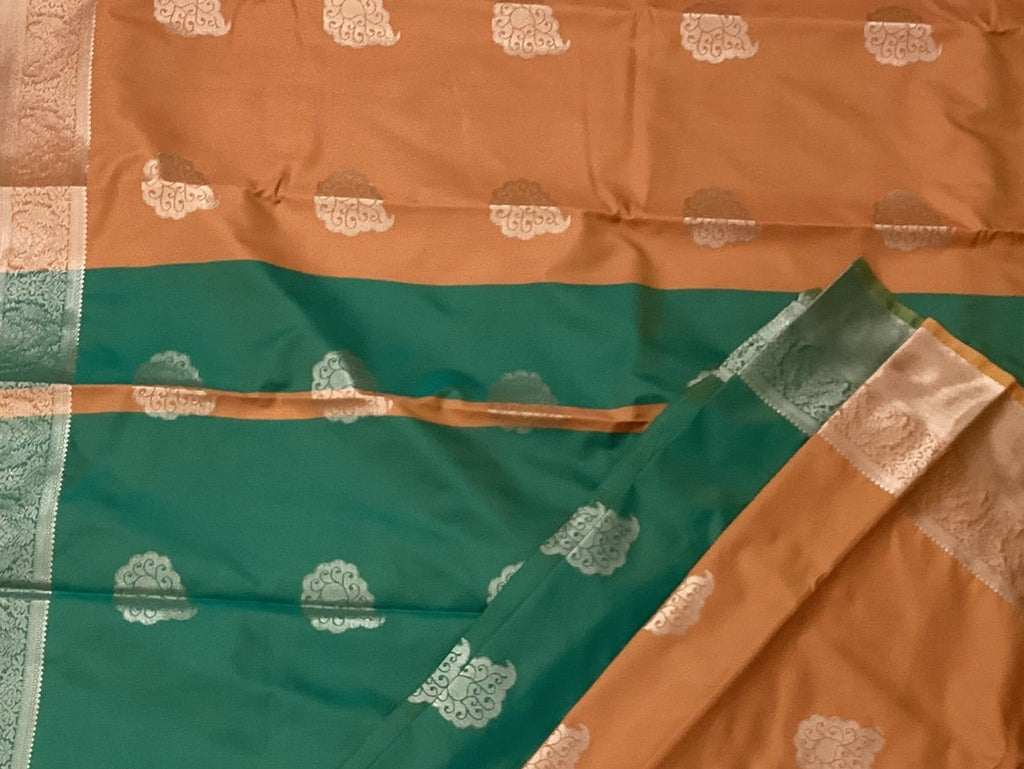 Teal And Burnt Orange Paisley Saree With Silver Brocade Border