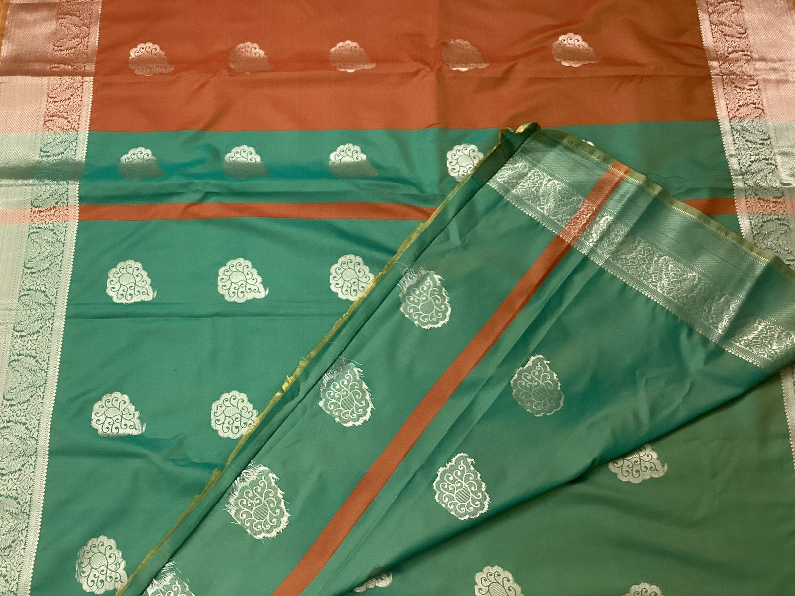 Teal Rust Silk Saree with Silver Buta and Brocade Border